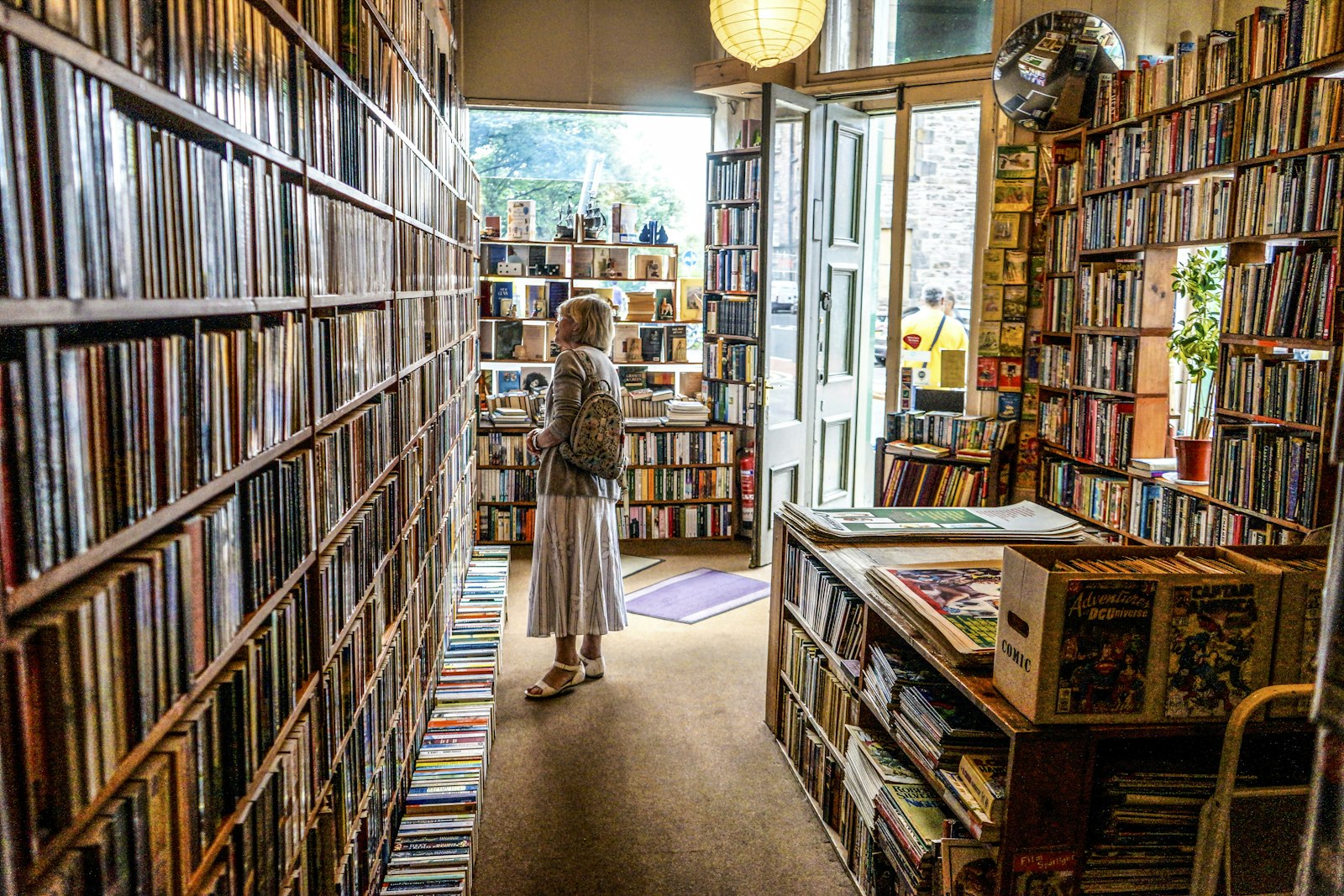 A customer browsing the shelves of an independent bookshop